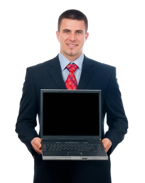 Aantrekkelijke jonge zakenman weergegeven: laptop geïsoleerd op wit — Stockfoto