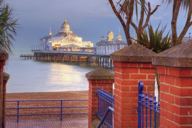 Eastbourne pier basking in late afternoon sun clipart