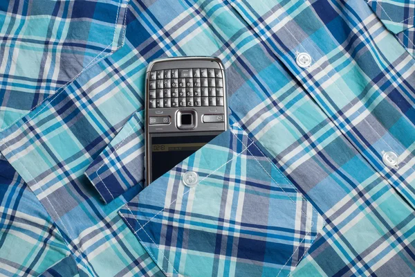 Teléfono en camisa de bolsillo —  Fotos de Stock