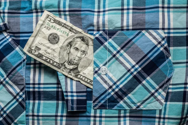Crumpled five dollars in poket shirt — Stock Photo, Image