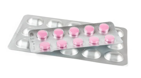 Tabletki w blistrach wyizolowane na białym — Zdjęcie stockowe