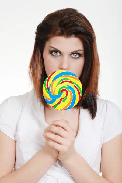 Young woman with colorful lollipop — Stock Photo, Image