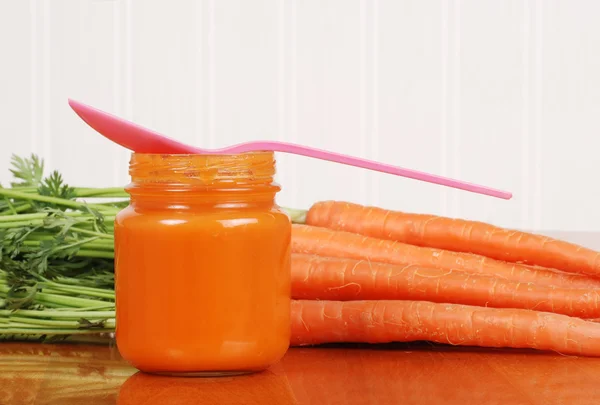 Closeup baby carrot food with spoon — Stock Photo, Image