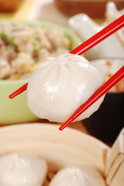 Macro chinese dumpling with chopsticks — Stock Photo, Image