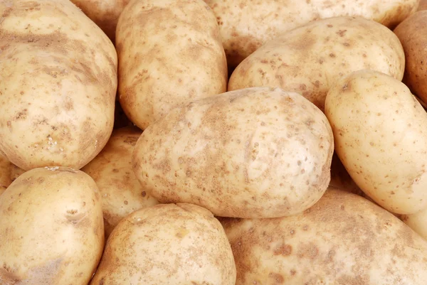 Potatoes making a background — Stok fotoğraf