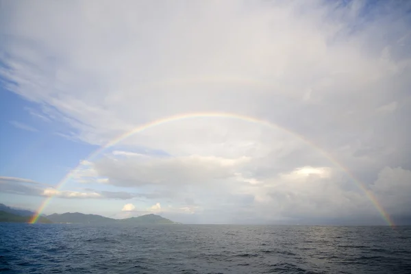 Rainbow over water — Stock Photo, Image