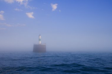 Lighthouse in fog clipart