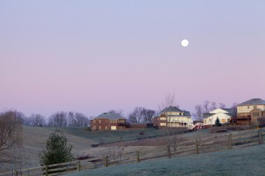 Moonset over a neighborhood clipart