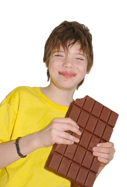 Boldog fiatal ember eszik csokoládé — Stock Fotó