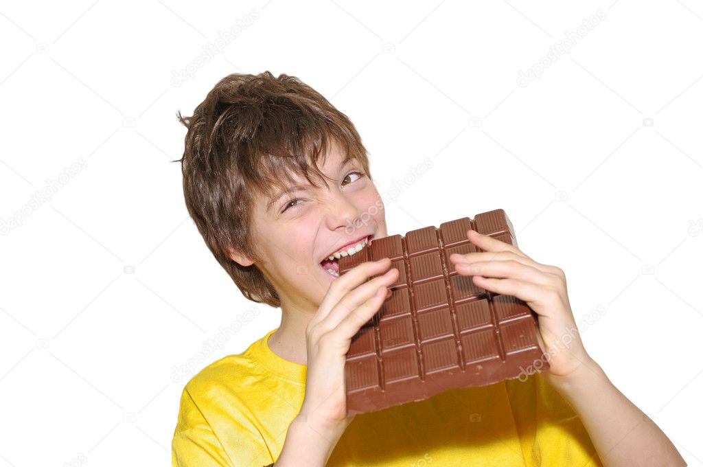 Happy young man eating chocolate