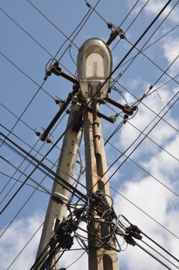 Wire pole with street lamp