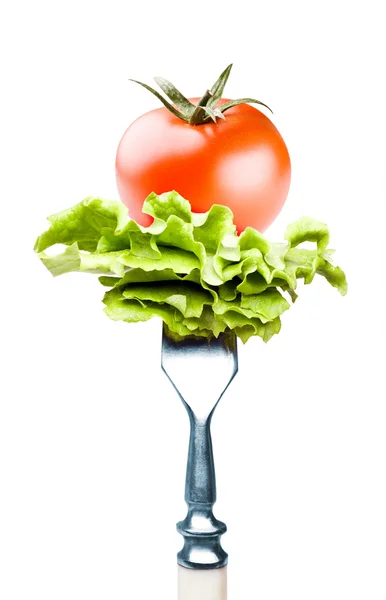 Tomato and salad on a fork — Stock Photo, Image