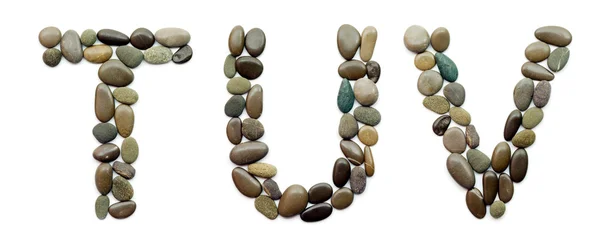 Алфавит океанских камней — стоковое фото