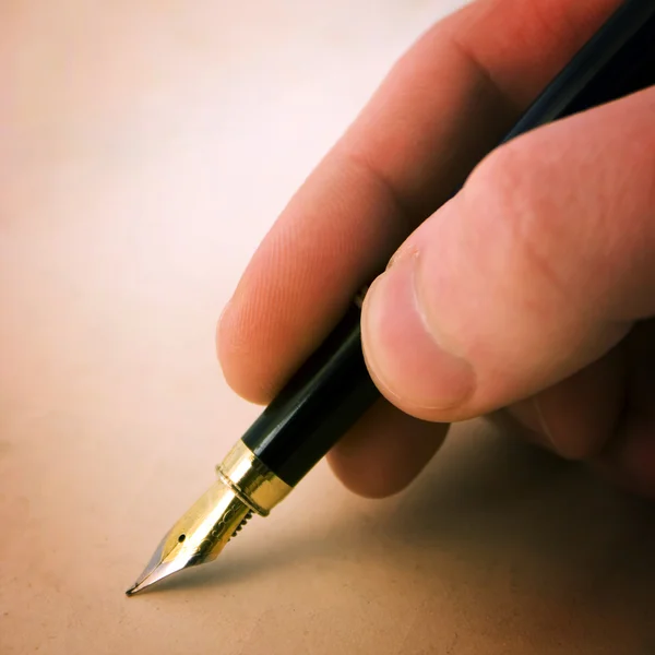 Pen with finger — Stock Photo, Image