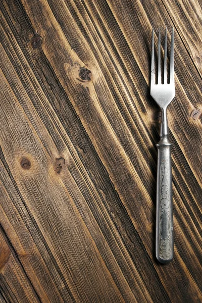 Tenedor sobre una superficie de madera —  Fotos de Stock