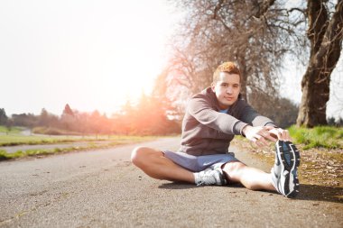 Mixed race man stretching clipart