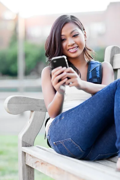 Asian student texting — Stock Photo, Image