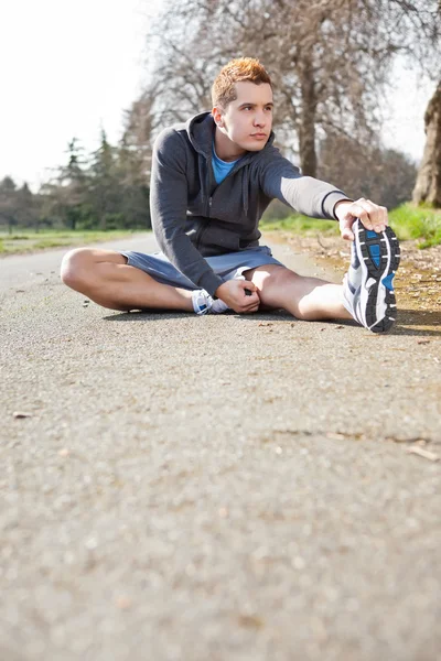 Mixed race man stretching — Stock Photo, Image