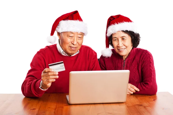 Ledande asiatiska par shopping online firar jul — Stockfoto