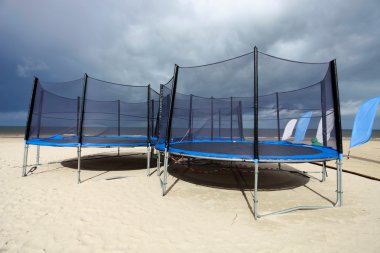 Trampolines in beach clipart