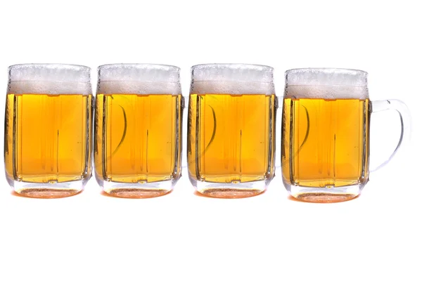 Cuatro cervezas Imágenes de stock libres de derechos
