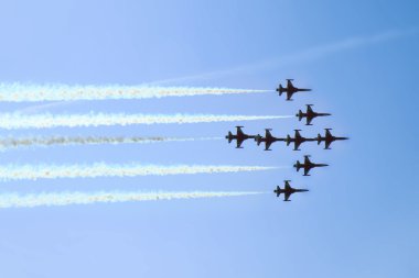 Aircrafts on the blue sky in the air show clipart