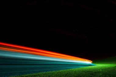 Abstract colorful lights in road tunnel clipart