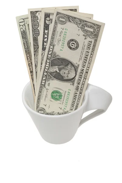 Dólares americanos en taza blanca para café —  Fotos de Stock