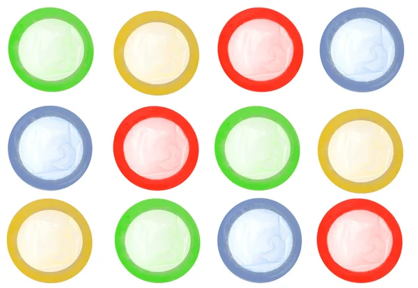 Выделенные цветные презервативы — стоковое фото