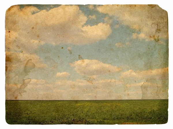 Grunge image of a field and sky with clouds — Stock Photo, Image