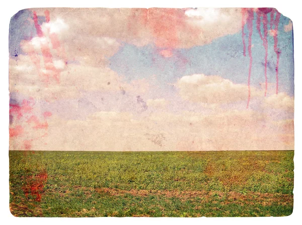 Imagem grunge de um campo e céu com nuvens — Fotografia de Stock