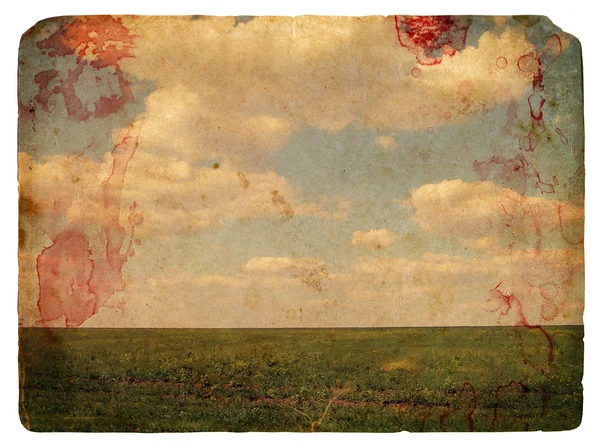 Grunge image of a field and sky with clouds — Stock Photo, Image