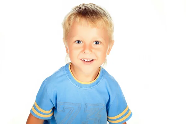Young caucasian kid smiles for a portrait in studio, isolated on — Stock Photo, Image