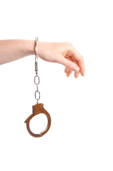 Hand wearing handcuffs — Stock Photo, Image