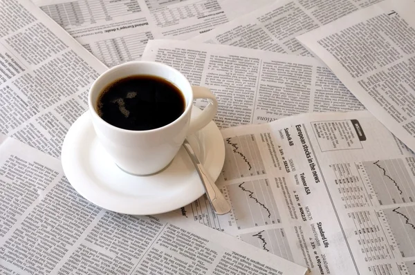 stock image Coffee over newspaper