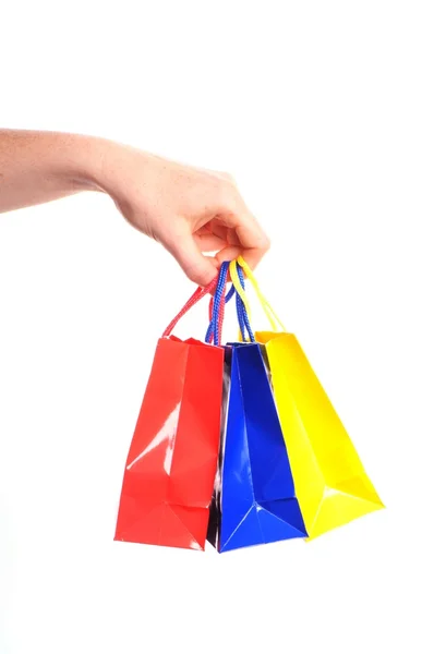 Bir sürü alışveriş poşetleri taşıyan — Stok fotoğraf