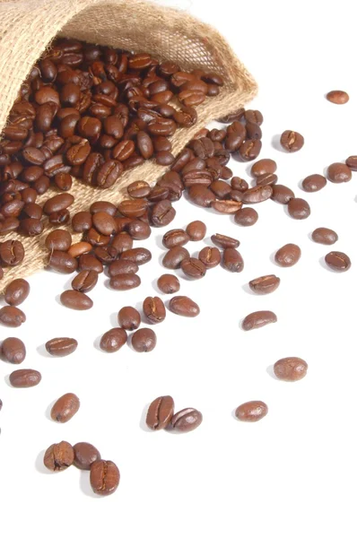 Kaffeebohnen und Plastiktüte — Stockfoto