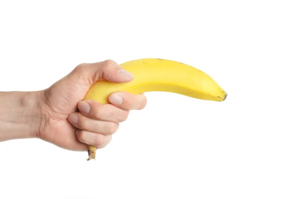 Mão segura uma banana — Fotografia de Stock