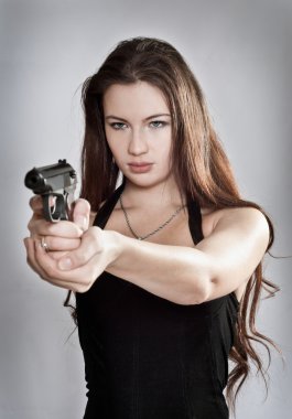 Girl aiming a gun