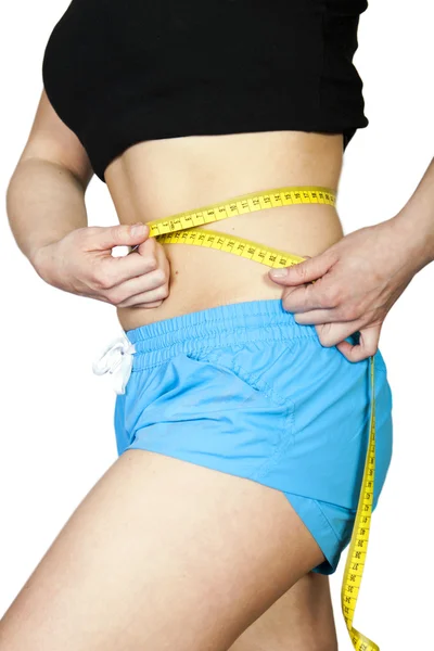 Mulher medindo seu corpo — Fotografia de Stock