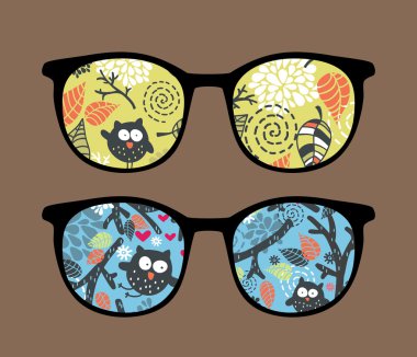 Retro sunglasses with owl on the tree reflection in it. clipart