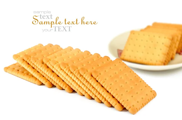 Heap of square crackers on a white background — Stock Photo, Image