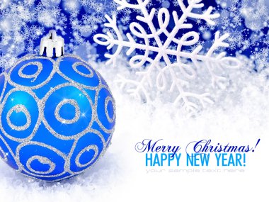 Blue ball and snowflake winter snow background with space for te clipart