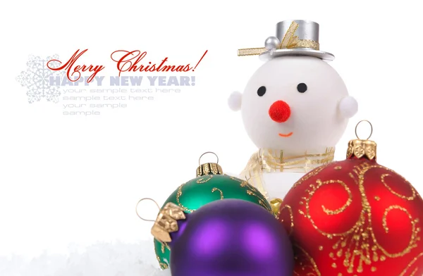 Snow man with color glass Christmas balls on white background wi — Stock Photo, Image