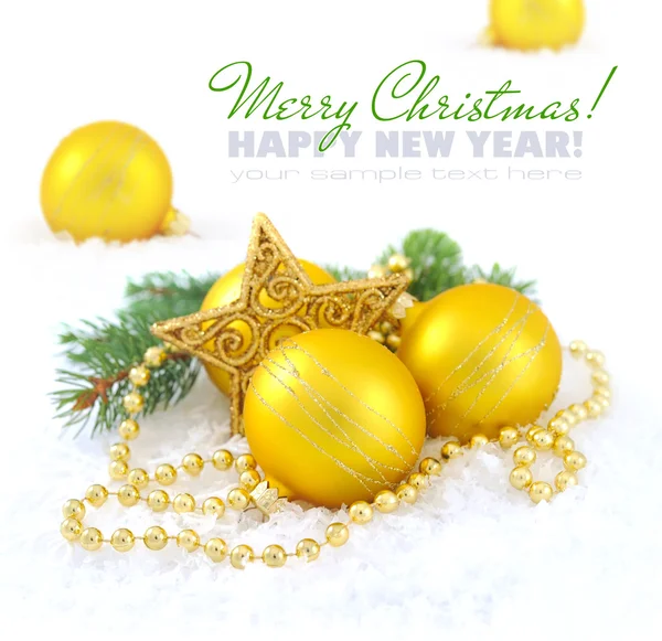 Christmas composition is with gold balls and star on snow — Stock Photo, Image