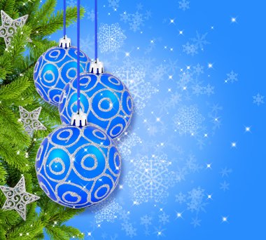 Blue and silver christmas decoration baubles and pine on blue ba clipart