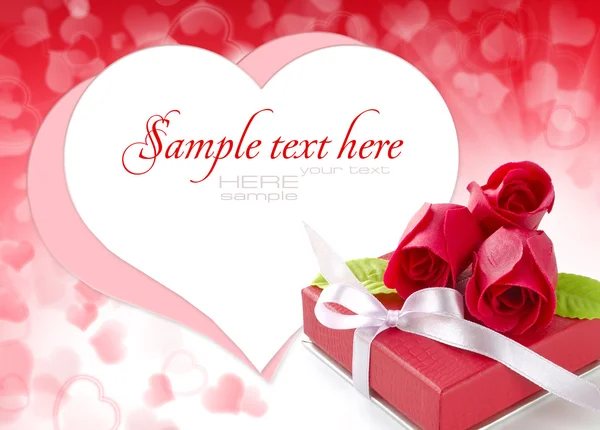 Little red gift with roses on background hearts — Stock Photo, Image