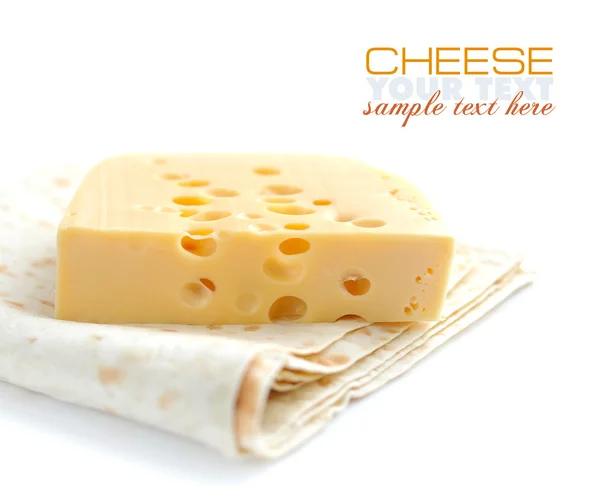 Piece of cheese on a pita on a white background — Stock Photo, Image