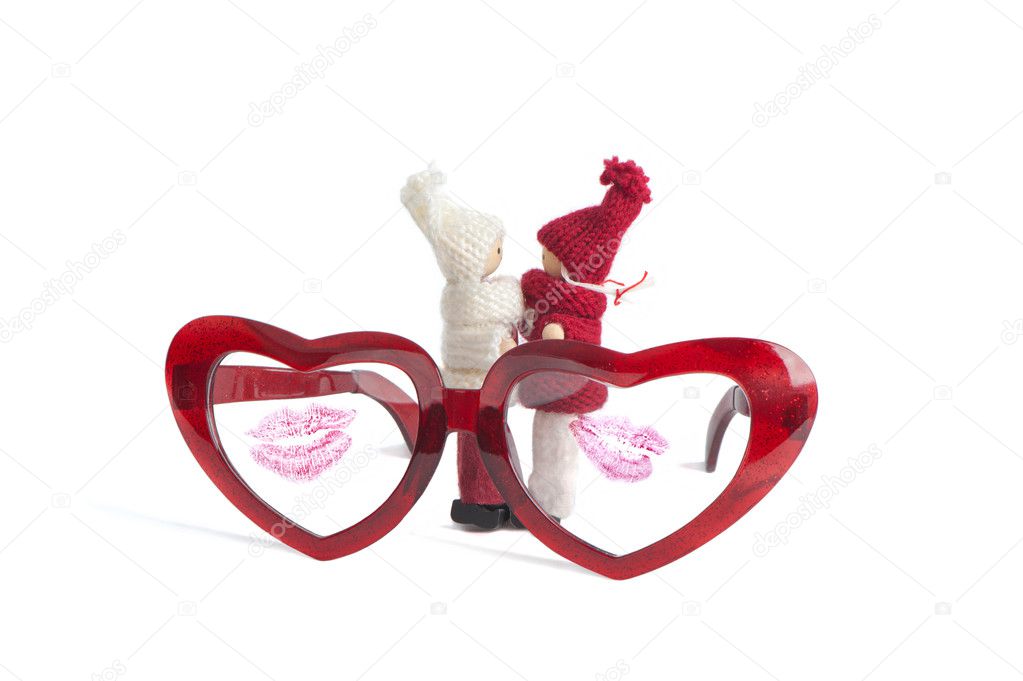 Red glasses with heart shape and dolls fot valentine