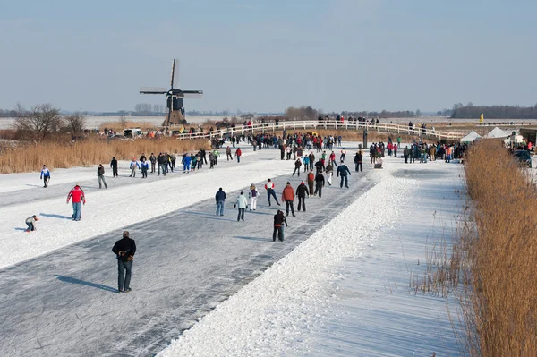 Schaatsers door de molen tour — Stockfoto